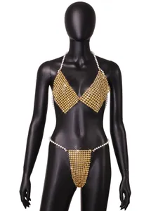 Detailed view of a luxurious gold metallic beaded bikini set with pearl straps on mannequin