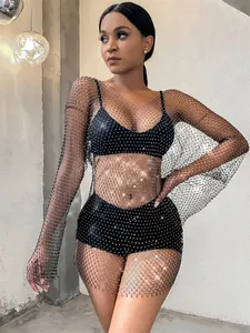 Detailed view of black rhinestone mesh long-sleeved dress with elegant sparkle finish