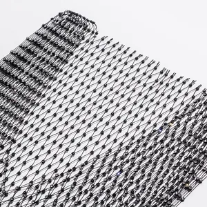 Detailed macro view of black fishnet fabric with sparkling rhinestone embellishments