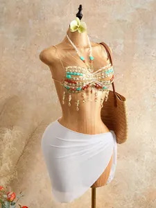 Detailed macro view of bohemian handmade beaded halter top with vibrant colorful fringes