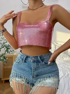 Close-up of a pink metallic mesh crop top showing shimmering sequins and thin straps