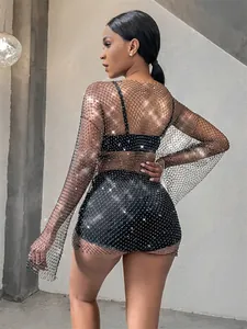 Back view of a long sleeve mesh dress with sparkling rhinestones for party wear.