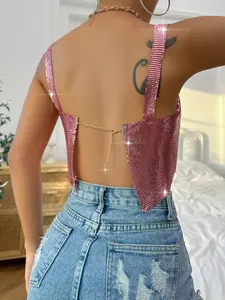 Close-up detail of a pink metallic sequin backless camisole with a delicate gold chain closure.