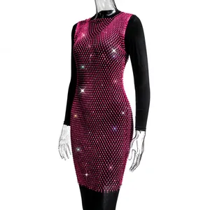 Detail view of hot pink mesh rhinestone dress showing sparkling crystal patterns