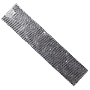 Close-up detail of black mesh fabric with sparkling rhinestones for evening dress