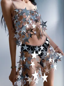Macro detail view of a sparkly silver star sequin hollow-out festival skirt for women.