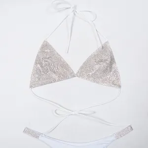 Exquisite detail of silver rhinestone bikini halter top featuring elegant white tie straps