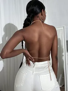 Back view of silver sparkly sequin halter top with delicate gold chain crisscross details