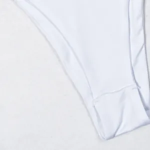 Close-up of white high-waisted swimsuit fabric detailing texture and stitching
