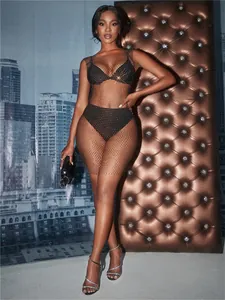 Stunning full-length view of black rhinestone fishnet dress showing crystal shimmer