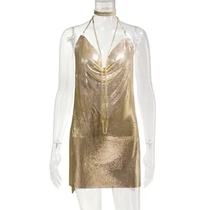 Close-up detail of a sexy gold metallic chainmail mini dress with deep V-neck on mannequin