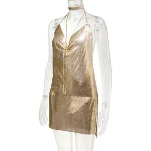 Detailed view of a sexy gold metallic chainmail mini dress with a deep V-neckline.