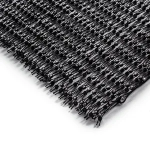 Macro close-up detail of black mesh fabric adorned with sparkling crystal rhinestones