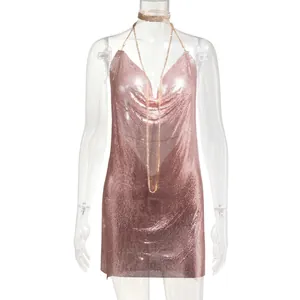 Close-up of pink metallic mesh mini dress with deep V-neck and halter chain straps.