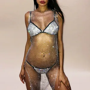 Macro detail of a sparkling rhinestone mesh dress with shimmering crystal beads
