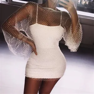 Elegant white bodycon dress with matching pearl-studded mesh long-sleeve overlay