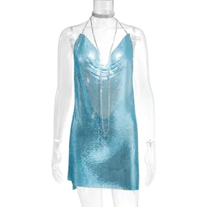 Detailed shot of a shimmering blue metallic chainmail dress with a deep V-neckline