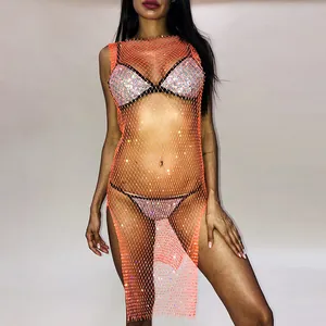 Macro view of orange rhinestone fishnet mini dress featuring sparkling mesh detail for parties