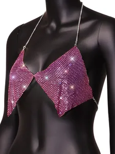 Close-up of sparkling pink rhinestone bra top with elegant silver chain details for party
