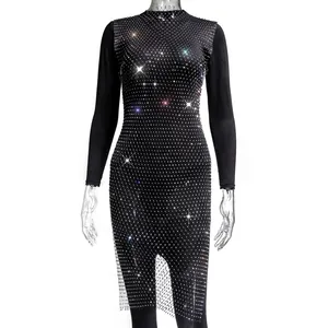 Detail of black long-sleeved mesh dress adorned with sparkling rhinestones