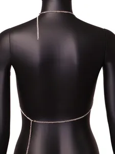 Back view detail of a silver-tone metal body chain on a black torso mannequin