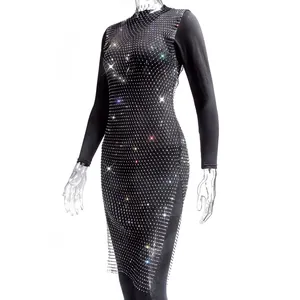 Detailed view of an elegant black mesh dress featuring shimmering rhinestone patterns