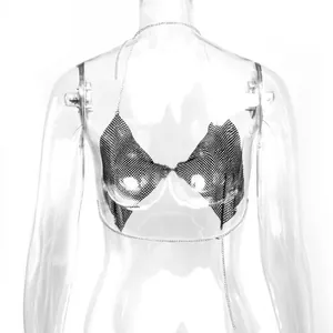 Detailed view of a sparkly rhinestone chain link bralette top on a clear mannequin