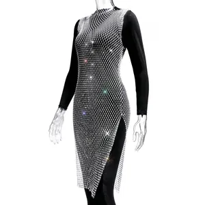 Detailed view of silver fishnet mesh dress with sparkling rhinestones and side slit