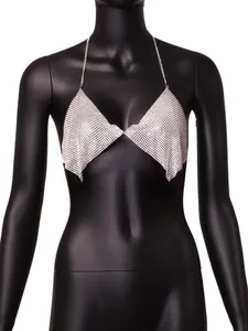 Detailed macro view of silver sequin halter top featuring sparkling metallic mesh fabric.