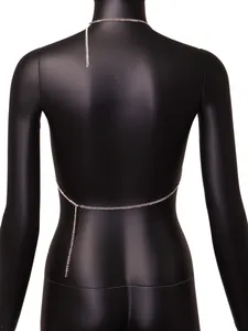 Detail of minimalist silver body chain on a black mannequin back view, ideal for clubwear