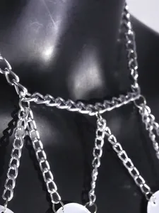 Macro detail of the sexy silver nightclub body chain featuring acrylic mirror discs.