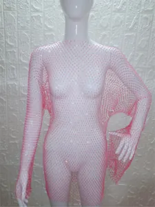 Close-up view of a pink long sleeve mesh dress decorated with sparkling rhinestones