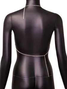 Detailed back view of a minimalist silver metal body chain on a black female mannequin.