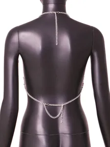 Detailed back view of a sexy silver-tone body chain accessory worn on a black mannequin