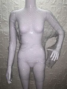 Detailed view of silver long-sleeved mesh dress with sparkling rhinestone accents