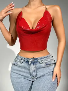 Close-up of red sexy metallic sequin halter crop top with delicate gold chain straps