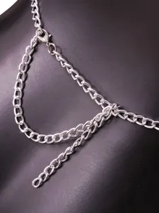 Detailed macro view of silver metal chain links with secure lobster clasp fastening