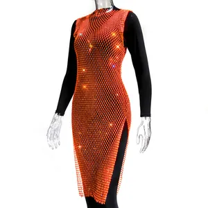 Close-up of orange mesh dress with sparkling rhinestones and side slit detail