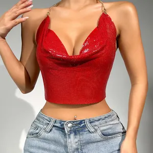 Detailed view of red metallic sequin halter top with gold chain straps and deep V-neck.
