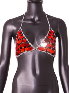 Detailed view of red acrylic heart sequins and silver chain on a sexy halter top