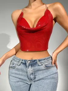 Close-up of sexy red metal sequin halter top with cowl neck and gold chain straps