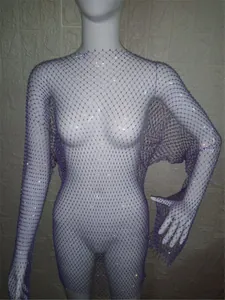 Close-up detail of purple long-sleeve mesh dress featuring sparkling rhinestone accents