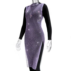 Detailed view of a purple fishnet dress decorated with sparkling rhinestones and high side slit