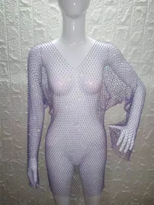 Close-up of a purple rhinestone mesh long sleeve dress on a white mannequin.