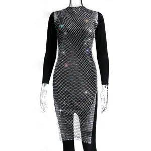 Detail view of black long sleeve dress with sparkling rhinestone mesh overlay and side slit.