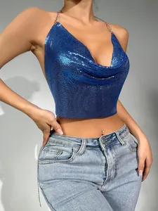 Sexy blue metallic sequin halter top featuring a backless drape design worn by model.