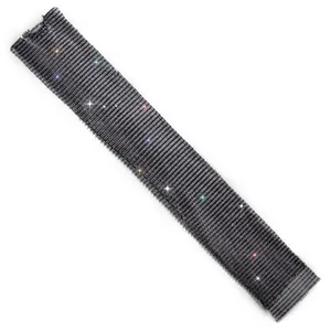 Detailed macro view of black sparkling rhinestone mesh fabric for elegant women's dress
