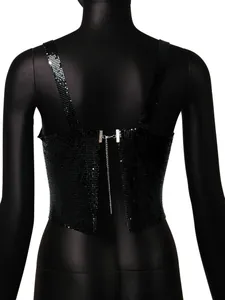 Back detail of a black sequined metallic camisole with a chain closure and split design.