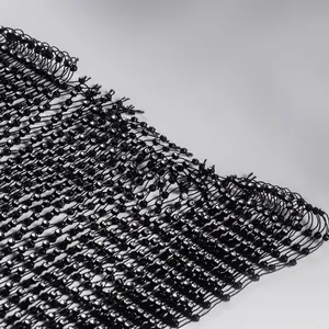 Detailed macro view of black mesh fabric adorned with sparkling crystal rhinestones