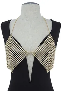 Close-up detail of a sparkling gold rhinestone halter body chain top for party wear